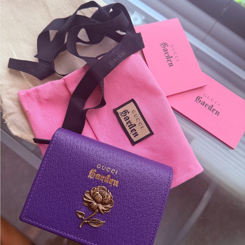 Gucci Purple Leather Wallet with Gold Floral Emblem